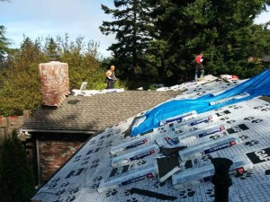 The front of the house gets underlayment before the shingles go on.